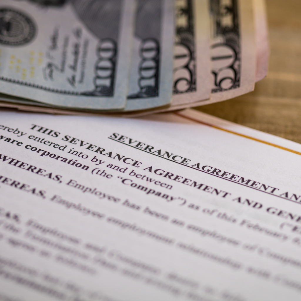 severance agreement and stack of cash